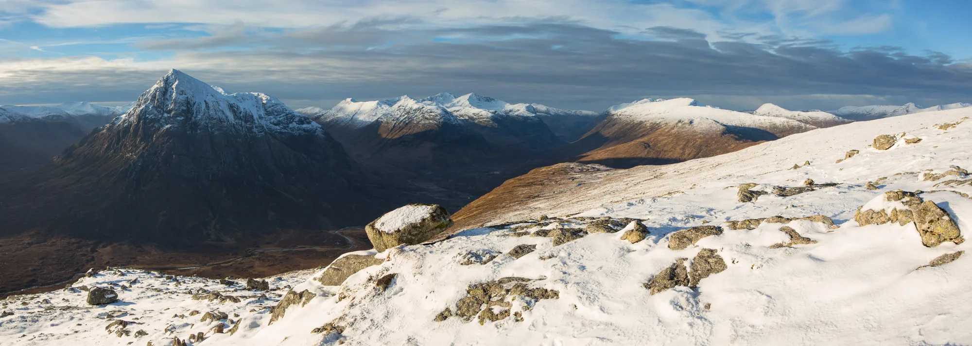 Buachaille Etive Mor and the Three Sisters of Glencoe taken from Bienn a' Chrùlaiste in the winter with snow on the ground. Scottish Highlands and Rannoch Moor Mountain Landscape Photography