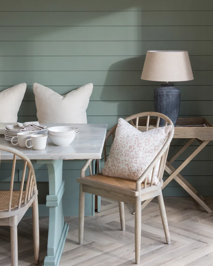 relaxed Dining table with matchboard wall in a holiday cottage