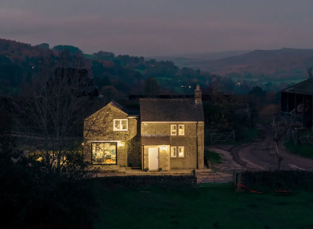 Dusk shot of a remote isolated holiday cottage in the peak district at night or dusk